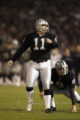 OAKLAND, CA - DECEMBER 2:  Sebastian Janikowski #11 of the Oakland Raiders and teammate Shane Lechler #9 follow the path of Janikowski's fiel goal attempt against the New York Jets at Network Associates Coliseum on December 2, 2002 in Oakland, California.