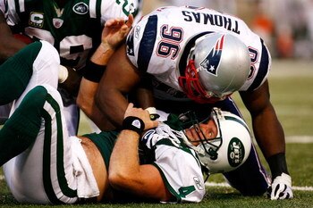 EAST RUTHERFORD, NJ - SEPTEMBER 14:  Quarterback Brett Favre #4 of the New York Jets is sacked by linebacker Adalius Thomas #96 late in the game on September 14, 2008 at Giants Stadium in East Rutherford, New Jersey. New England won 19-10.  (Photo by Jarr