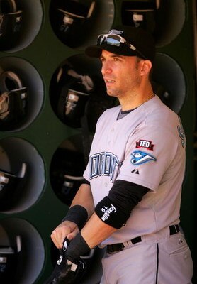 OAKLAND, CA - MAY 09:  Marco Scutaro #19 of the Toronto Blue Jays stands in the dugout before their game against the Oakland Athletics on May 9, 2009 at the Oakland Coliseum in Oakland, California.  (Photo by Ezra Shaw/Getty Images)