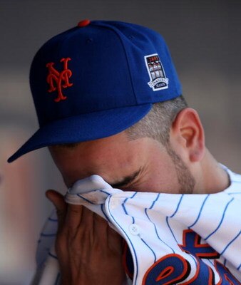 NEW YORK - APRIL 26:  Oliver Perez #46 of the New York Mets reacts in the dugout after he was taken out of their game against the Washington Nationals in the fifth inning on April 26, 2009 at Citi Field in the Flushing neighborhood of the Queens borough o