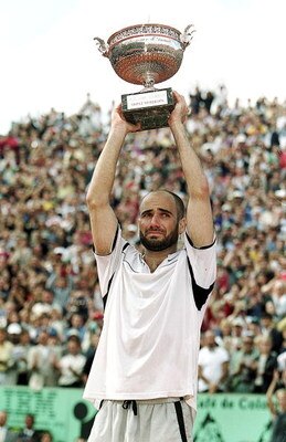 6 Jun 1999:  Andre Agassi of the USA lifts the trophy high above his head after defeating Andrei Medvedev of the Ukraine to win the men's singles final of the French Open at Roland Garros in Paris, France. Mandatory Credit: Al Bello  /Allsport