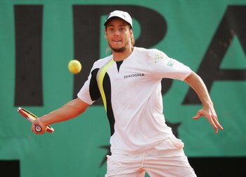 PARIS - JUNE 04:  Gaston Gaudio of Argentina in action against Nikolay Davydenko of Russia during day eight of the French Open at Roland Garros on June 4, 2006 in Paris, France.  (Photo by Matthew Stockman/Getty Images)