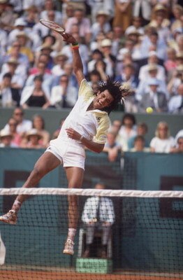 French tennis player Yannick Noah competes in the Men's Singles of the 1983 French Open. (Photo by Steve Powell/Getty Images)
