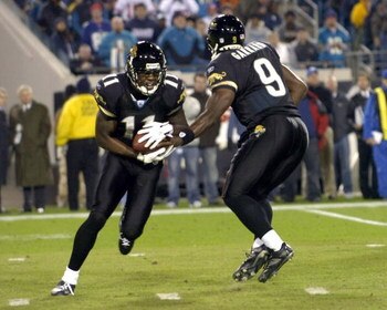Jacksonville Jaguars quarterback David Garrard hands off to wide receiver Reggie Williams against the New York Giants on ESPN Monday Night Football Nov. 20, 2006 in Jacksonville.  The Jaguars won 26 - 10.  (Photo by Al Messerschmidt/Getty Images)