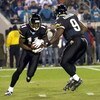 Jacksonville Jaguars quarterback David Garrard hands off to wide receiver Reggie Williams against the New York Giants on ESPN Monday Night Football Nov. 20, 2006 in Jacksonville.  The Jaguars won 26 - 10.  (Photo by Al Messerschmidt/Getty Images)