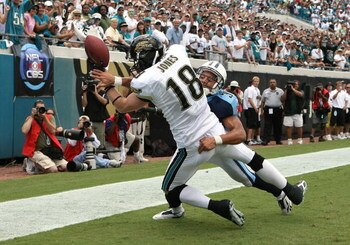 JACKSONVILLE, FL - SEPTEMBER 9:  Cornerback Cortland Finnegan #31 of the Tennessee Titans knocks away the ball in the end-zone as wide receiver Matt Jones #18 of the Jacksonville Jaguars can't come down with a reception at Alltel Stadium September 9, 2007