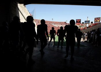 LOS ANGELES - SEPTEMBER 5:  San Jose State Spartans players walk out of the tunnel onto the field before the game with the USC Trojans on September 5, 2009 at the Los Angeles Coliseum in Los Angeles, California.   (Photo by Stephen Dunn/Getty Images)