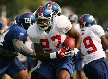 ALBANY, NY - JULY 31:  Brandon Jacobs #27 runs the ball during the New York Giants training camp on July 31, 2006 at the University at Albany in Albany, New York.  (Photo by Nick Laham/Getty Images)