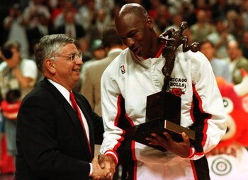 21 May 1996:  Guard Michael Jordan of the Chicago Bulls shakes hands with NBA Commissioner David Stern as he is presented with the 1996 NBA Most Valuable Player award prior to the start of game two in the NBA Eastern Conference Finals against the Orlando