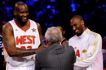 PHOENIX - FEBRUARY 15:  Co-MVPs Shaquille O'Neal #32 and Kobe Bryant #24 of the Western Conference receive the trophy from NBA Commissioner David Stern after the Western Conference defeated the Eastern Conference in the 58th NBA All-Star Game, part of 200