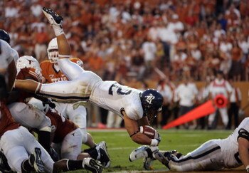 AUSTIN, TX - SEPTEMBER 20:  James Casey #12 of the Rice Owls dives during the game against the Texas Longhorns on September 20, 2008 at Darrell K Royal-Texas Memorial Stadium in Austin, Texas. Texas won 52-10. (Photo by Brian Bahr/Getty Images)