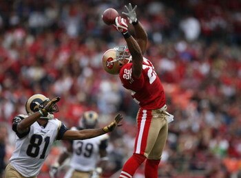 SAN FRANCISCO - NOVEMBER 18:  Tory Holt #81 of the St. Louis Rams almost has a pass intercepted by Nate Clements #22 of the San Francisco 49ers at Monster Park November 18, 2007 in San Francisco, California.  (Photo by Jed Jacobsohn/Getty Images)