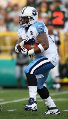 GREEN BAY, WI - AUGUST 28: LenDale White #25 of the Tenessee Titans runs for yardage against the Green Bay Packers on August 28, 2008 at Lambeau Field in Green Bay, Wisconsin. The Titans defeated the Packers 23-21. (Photo by Jonathan Daniel/Getty Images)