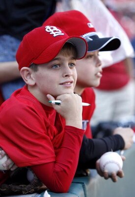 ST. LOUIS, MO - APRIL 1:   Cardinals fans watch batting practice before the Opening Day game on April 1, 2007 at Busch Stadium in St. Louis, Missouri.  (Photo by Dilip Vishwanat/Getty Images)