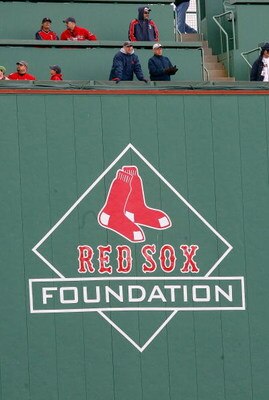 BOSTON - APRIL 7:  Fans sit in the Monster Seats before an Opening Day game between the Boston Red Sox and the Tampa Bay Rays at Fenway Park, April 7, 2009, in Boston, Massachusetts. (Photo by Jim Rogash/Getty Images)
