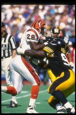 19 Sep 1993:  Running back Harold Green of the Cincinnati Bengals (left) gets hit by a Pittsburgh Steelers player during a game at Three Rivers Stadium in Pittsburgh, Pennsylvania.  The Steelers won the game, 34-7. Mandatory Credit: Rick Stewart  /Allspor