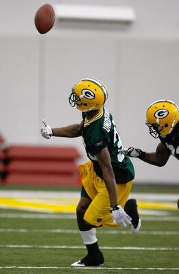 GREEN BAY, WI - MAY 1:  Defensive back Brandon Underwood #33 looks back to catch the football as he participates in practice drills during Green Bay Packers Minicamp at Don Hutson Center on May 1, 2009 in Green Bay, Wisconsin. (Photo by Scott Boehm/Getty 