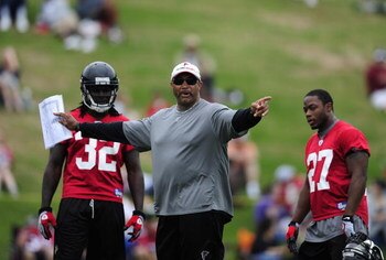 FLOWERY BRANCH, GA - MAY 9: Running backs Jerious Norwood #32 and Thomas Brown #27 of the Atlanta Falcons look on during instruction by running backs coach Gerald Brown during minicamp at the Falcons Complex on May 9, 2009 in Flowery Branch, Georgia.  (Ph