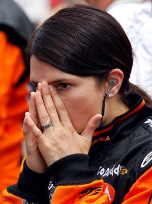 INDIANAPOLIS - MAY 24:  Danica Patrick, driver of the #7 Boost Mobile/Motorola Andretti Green Racing Dallara Honda, prepares to enter her car prior to the start of the IRL IndyCar Series 93rd running of the Indianapolis 500 on May 24, 2009 at the Indianap