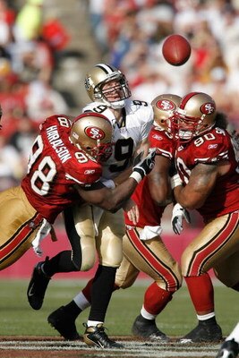 SAN FRANCISCO - OCTOBER 28:  Quarterback Drew Brees #9 of the New Orleans Saints is hit as he throws a pass by linebacker Parys Haralson #98 of the San Francisco 49ers during a game at Monster Park October 28, 2007 in San Francisco, California. New Orlean
