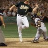 13 Oct 2001:  Jeremy Giambi of the Oakland A's is tagged out by Jorge Posada of the New York Yankees during game three of the American League Divisional Series at the Network Associaties Ceolesium in Oakland, Ca. < DIGITAL IMAGE> Mandatory Credit: Jed Jac