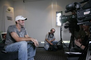 DALLAS - OCTOBER 23:  Dallas Cowboys quarterback Tony Romo looks on at Terence Newman's home October 23, 2007 in Dallas, Texas.  (Photo by Jensen Walker/Getty Images for Guitar Hero)