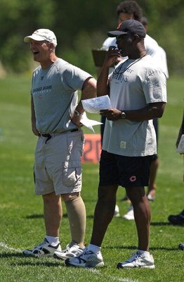 LAKE FOREST, IL - MAY 20: Head coach Lovie Smith of the Chicago Bears (R) and defensive line coach Rod Marinelli watch an organized team activity (OTA) practice on May 20, 2009 at Halas Hall in Lake Forest, Illinois. (Photo by Jonathan Daniel/Getty Images