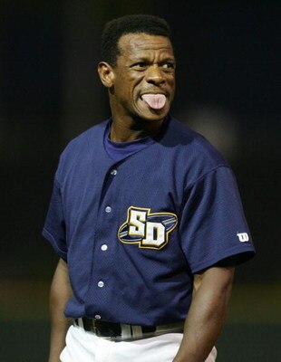 SAN DIEGO- JULY 19:  Rickey Henderson, who plays baseball for the San Diego Surf Dawgs of the Golden League, an independent professional baseball organization, sticks his tounge out after making an out at a game at Tony Gwyn Stadium in San Diego, Californ