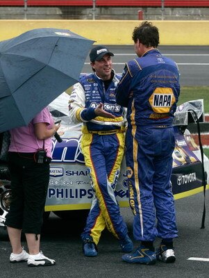 CONCORD, NC - MAY 25:  David Reutimann (C), driver of the #00 Aaron's Dream Machine Toyota, talks with Michael Waltrip (R), driver of the #55 NAPA Auto Parts Toyota, during the NASCAR Sprint Cup Series Coca-Cola 600 on May 25, 2009 at Lowe's Motor Speedwa