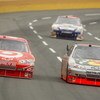 CONCORD, NC - MAY 25:  Juan Pablo Montoya, driver of the #42 Target Chevrolet, races Martin Truex Jr., driver of the #1 Bass Pro Shops/Tracker Boats Chevrolet, during the NASCAR Sprint Cup Series Coca-Cola 600 on May 25, 2009 at Lowe's Motor Speedway in C