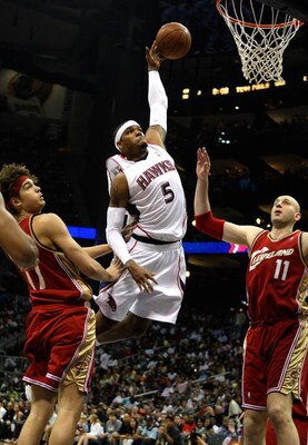 ATLANTA - MAY 09:  Josh Smith #5 of the Atlanta Hawks drives the basket against Zydrunas Ilgauskas #11 and Anderson Varejao #17 of the Cleveland Cavaliers in Game Three of the Eastern Conference Semifinals during the 2009 NBA Playoffs at Philips Arena on 