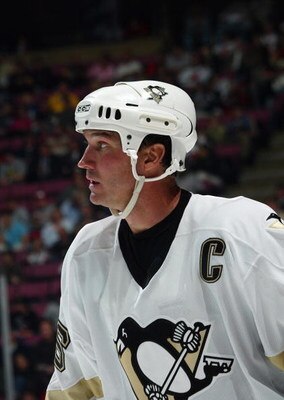 EAST RUTHERFORD, NJ - OCTOBER 5:  Mario Lemieux #66 of the Pittsburgh Penguins looks on during a break in action against the New Jersey Devils during their NHL opening night game at the Continental Airlines Arena on October 5, 2005 in East Rutherford, New