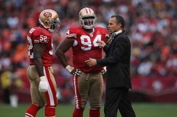 SAN FRANCISCO - NOVEMBER 18:  Head coach Mike Nolan of the San Francisco 49ers talks with Patrick Willis #52 and Marques Douglas #94 during the game against the St. Louis Rams on November 18, 2007 at Monster Park in San Francisco, California. (Photo by Je