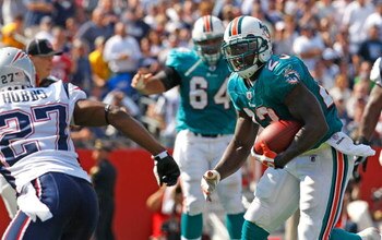 FOXBORO, MA - SEPTEMBER 21: Ronnie Brown #23 of the Miami Dolphins runs for yardage against the New England Patriots at Gillette Stadium on September 21, 2008 in Foxboro, Massachusetts. The Dolphins won 38-13. (Photo by Jim Rogash/Getty Images)