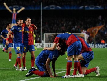 BARCELONA, SPAIN - MARCH 11:  Seydou Keita (C) of Barcelona sits on his knees celebrates scoring during the UEFA Champions League, First knock-out round, second leg match between Barcelona and Lyon at the Camp Nou stadium on March 11, 2009 in Barcelona, S