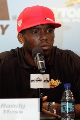 DAYTONA BEACH, FL - JULY 03:  NFL player Randy Moss of the New England Patriots speaks to the media during a press conference prior to the start of practice for the NASCAR Sprint Cup Series Coke Zero 400 at Daytona International Speedway on July 3, 2008 i