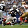 IRVING, TX - NOVEMBER 23:  Running back Marion Barber #24 of the Dallas Cowboys runs the ball against Takeo Spikes #51 of the San Francisco 49ers at Texas Stadium on November 23, 2008 in Irving, Texas.  (Photo by Ronald Martinez/Getty Images)