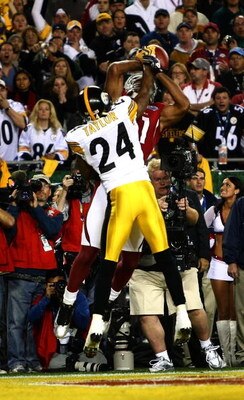 TAMPA, FL - FEBRUARY 01:  Wide receiver Larry Fitzgerald #11 of the Arizona Cardinals makes a 1-yard touchdown reception in the fourth quarter against Ike Taylor #24 of the Pittsburgh Steelers during Super Bowl XLIII on February 1, 2009 at Raymond James S