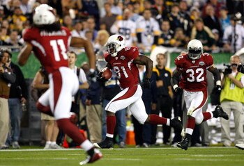 TAMPA, FL - FEBRUARY 01:  Anquan Boldin #81 of the Arizona Cardinals runs for yards after the catch as Larry Fitzgerald #11 and Edgerrin James #32 get in position to block against the Pittsburgh Steelers during Super Bowl XLIII on February 1, 2009 at Raym