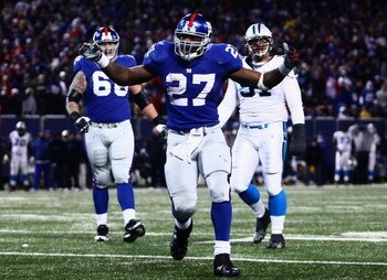 EAST RUTHERFORD, NJ - DECEMBER 21:  Running back Brandon Jacobs #27 of the New York Giants celebrates in the end zone after scoring a touchdown against the Carolina Panthers on December 21, 2008 at Giants Stadium in East Rutherford, New Jersey.  (Photo by