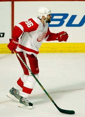 CHICAGO - MAY 22:  Tomas Holmstrom #96 of the Detroit Red Wings celebrates after Jonathan Ericsson #52 scored a goal in the second period against the Chicago Blackhawks during Game Three of the Western Conference Championship Round of the 2009 Stanley Cup