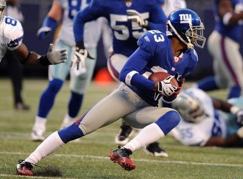 EAST RUTHERFORD, NJ - NOVEMBER 02:  Corey Webster #23 of the New York Giants runs back an interception against the Dallas Cowboys and Aaron Ross #31 follow during their game on November 2, 2008 at Giants Stadium in East Rutherford, New Jersey.  (Photo by 
