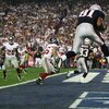 GLENDALE, AZ - FEBRUARY 03:  Wide receiver Randy Moss #81 of the New England Patriots catches a six-yard touchdown pass from Tom Brady #12 in front of cornerback Corey Webster #23 of the New York Giants in the fourth quarter of Super Bowl XLII on February