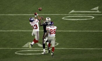 GLENDALE, AZ - FEBRUARY 03:  Corey Webster #23 of the New York Giants breaks up a pass intended for Randy Moss #81 of the New England Patriots on the Patriots final drive of the game with less then a minute to go in the game during Super Bowl XLII on Febr