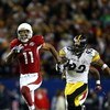 TAMPA, FL - FEBRUARY 01:  Larry Fitzgerald #11 of the Arizona Cardinals runs for a touchdown after a catch against James Harrison #92 of the Pittsburgh Steelers in the fourth quarter during Super Bowl XLIII on February 1, 2009 at Raymond James Stadium in 