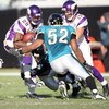 JACKSONVILLE, FL - NOVEMBER 23:  Andrian Peterson #28 of the Minnesota Vikings is tackled by Daryl Smith #52 of the Jacksonville Jaguars during the game at Jacksonville Municipal Stadium on November 23, 2008 in Jacksonville, Florida.  (Photo by Sam Greenw