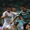 LISBON, PORTUGAL - MARCH 13:  Danny Braaten (left) of Bolton chases down Grimi during the UEFA Cup Round of 16 second leg match between Sporting Lisbon and Bolton Wanderers at the Alvalade XXI Stadium on March 13, 2008 in Lisbon, Portugal.  (Photo by Mich