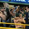 GREEN BAY, WI - DECEMBER 28: Fans of the Green Bay Packers celebrate after hearing the Minnesota Vikings were defeated by the Arizona Cardinals making the Packers the NFC North Division champions during a game against the Denver Broncos December 28, 2003 