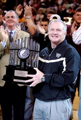 WINSTON-SALEM, NC - JANUARY 30:  Head football coach Jim Grobe of the Wake Forest Demon Deacons accepts the Atlantic Coast Conference Championship trophy at halftime during the game against the Georgia Tech Yellow Jackets on January 30, 2007 at Lawrence J