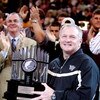 WINSTON-SALEM, NC - JANUARY 30:  Head football coach Jim Grobe of the Wake Forest Demon Deacons accepts the Atlantic Coast Conference Championship trophy at halftime during the game against the Georgia Tech Yellow Jackets on January 30, 2007 at Lawrence J